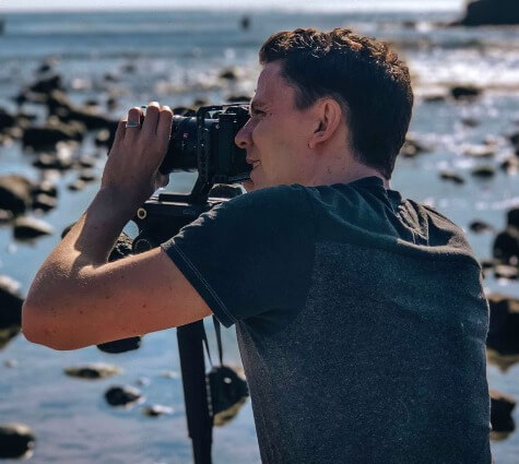Logan Peralta of LP Creative Media shooting video on the shore