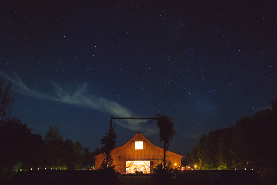 Nighttime exterior of the wedding barn at Forever Farms winery.